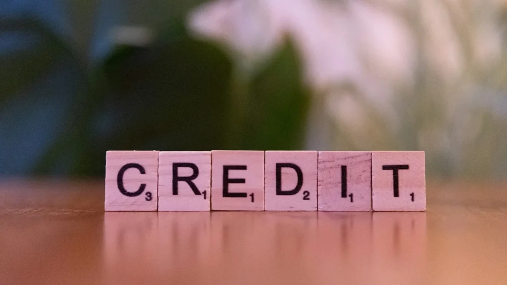 Letter tiles spelling CREDIT, what a consumer proposal does to your credit report